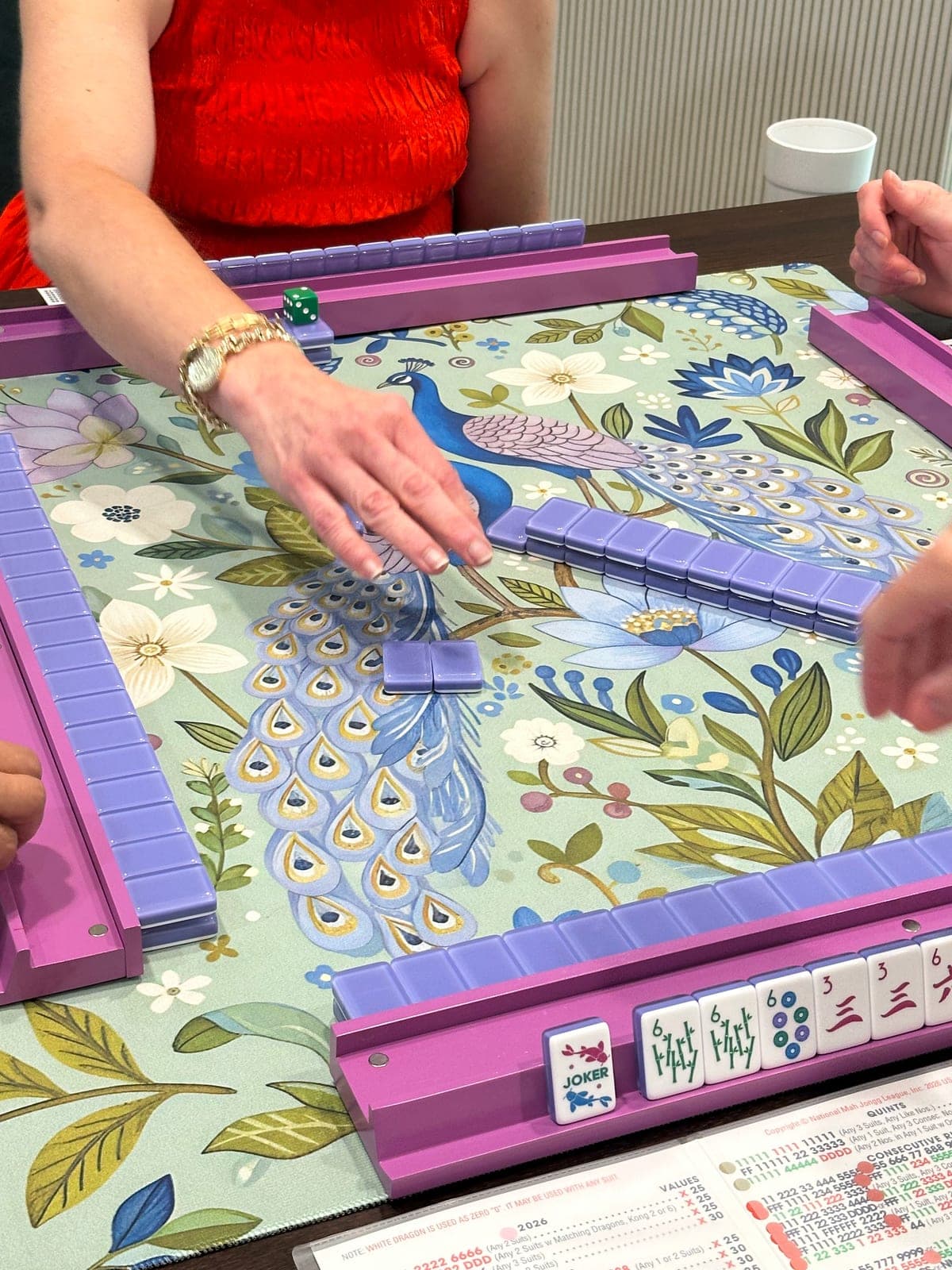 Players enjoying American mahjong at a styled table in Baldwin County.