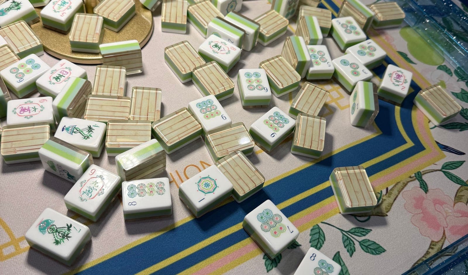 Players enjoying American mahjong at a styled table in Denton County.