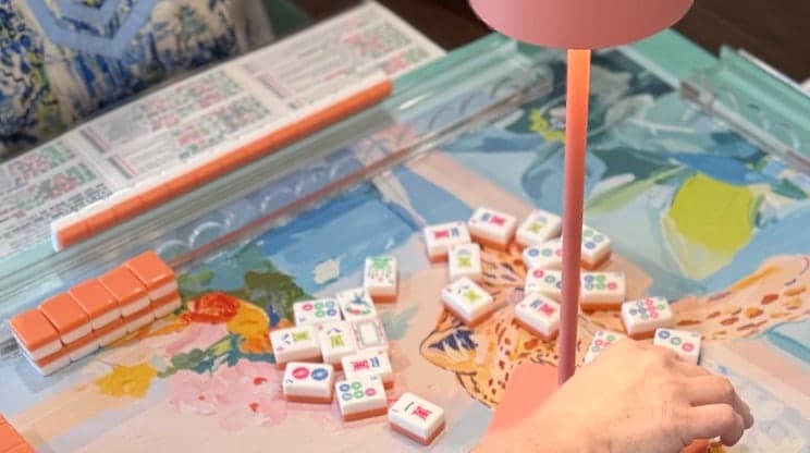 Players enjoying American mahjong at a styled table in Enterprise.