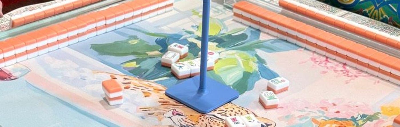 Players enjoying American mahjong at a styled table in North Tarrant Co..