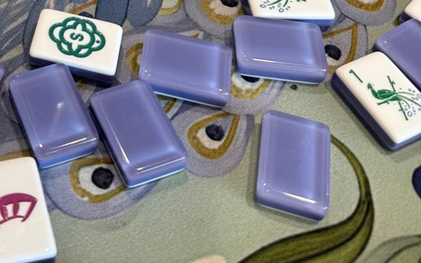 Players enjoying American mahjong at a styled table in Greater Boston Metro.