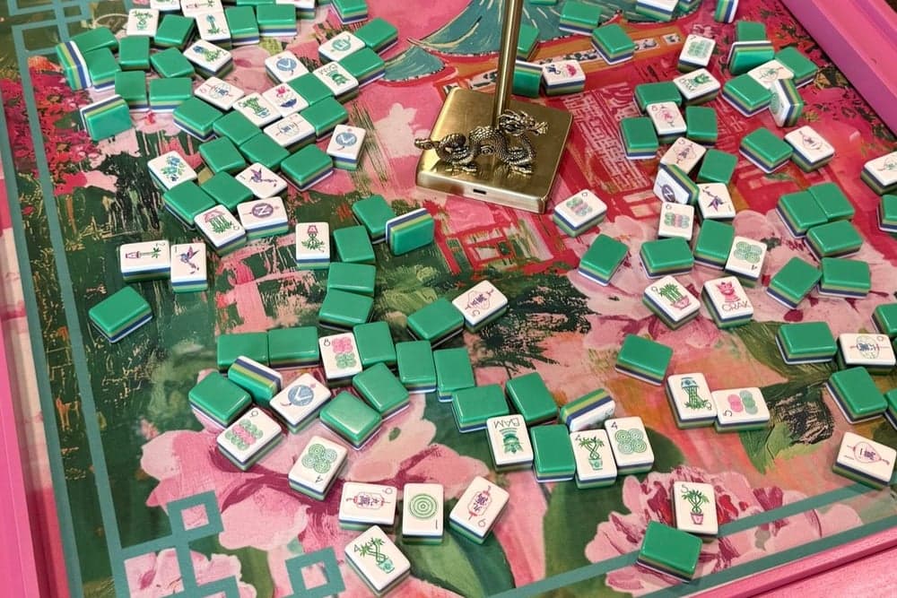 Players enjoying American mahjong at a styled table in Collin County.