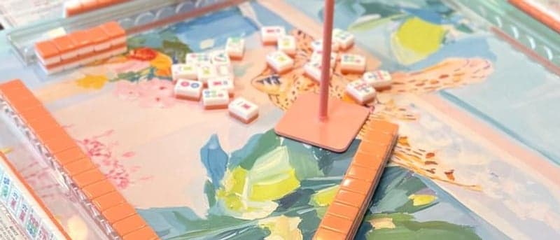 Players enjoying American mahjong at a styled table in Northwest.