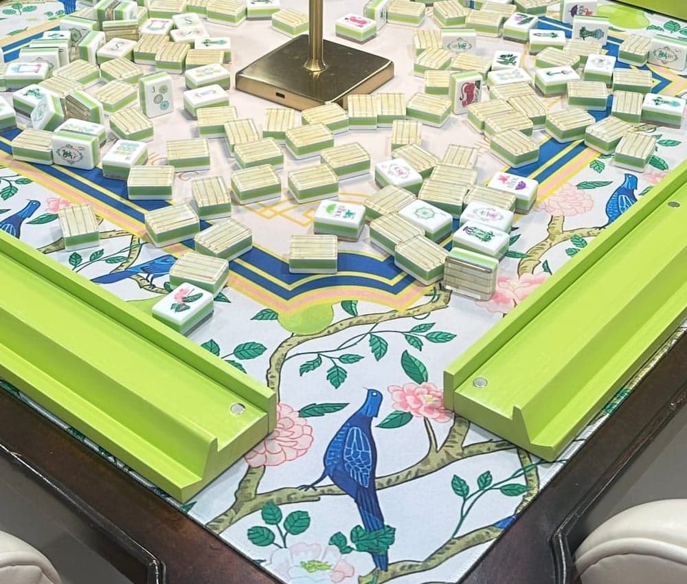 Players enjoying American mahjong at a styled table in Raleigh.