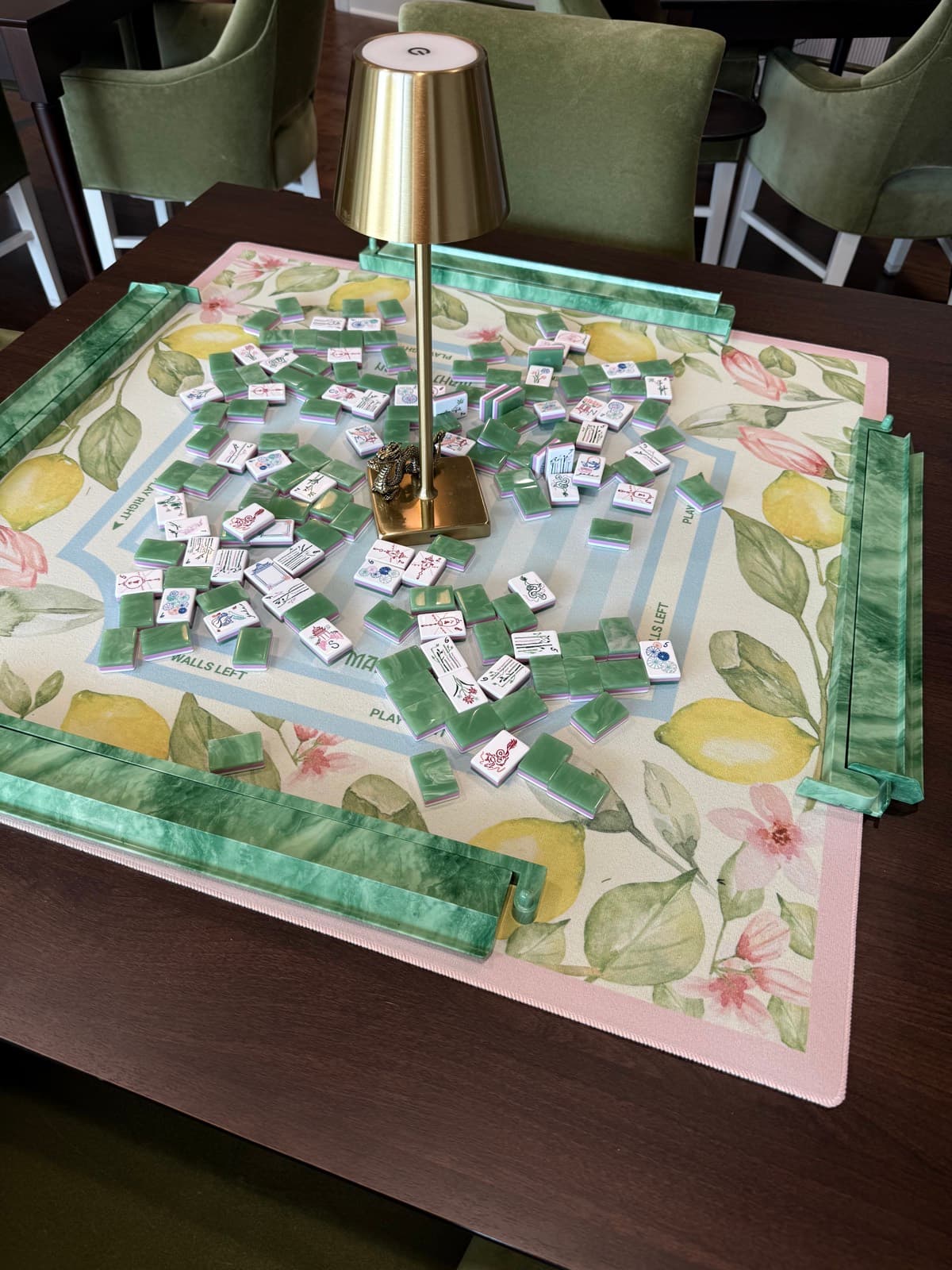 Players enjoying American mahjong at a styled table in Rankin County.
