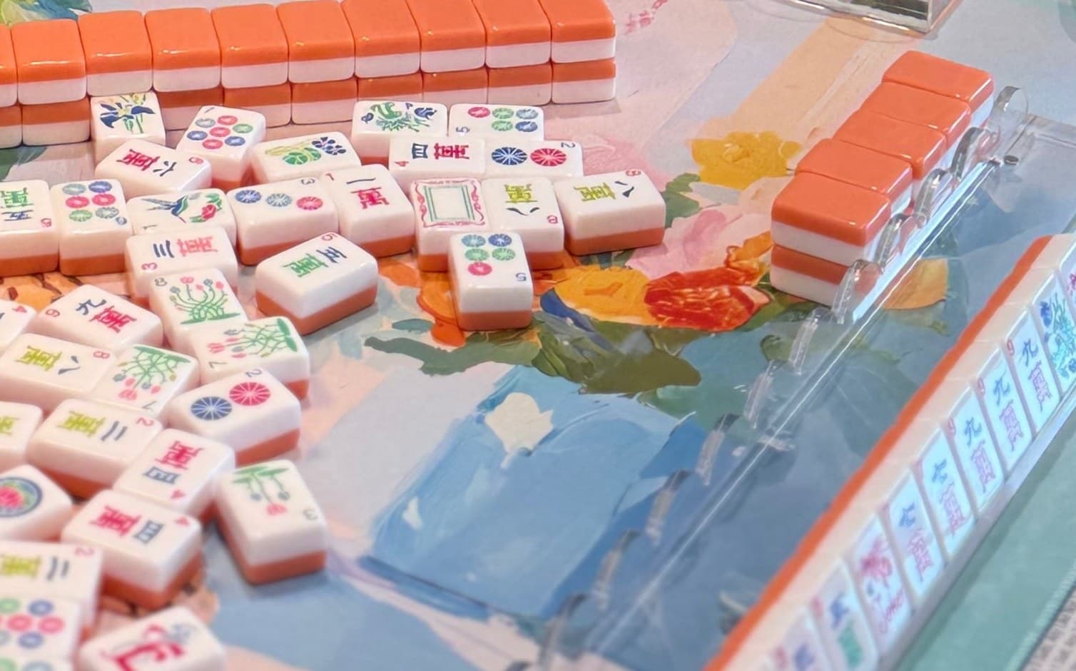Players enjoying American mahjong at a styled table in Oklahoma City.