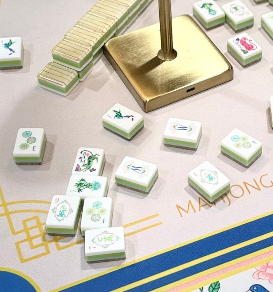 Players enjoying American mahjong at a styled table in Midland.