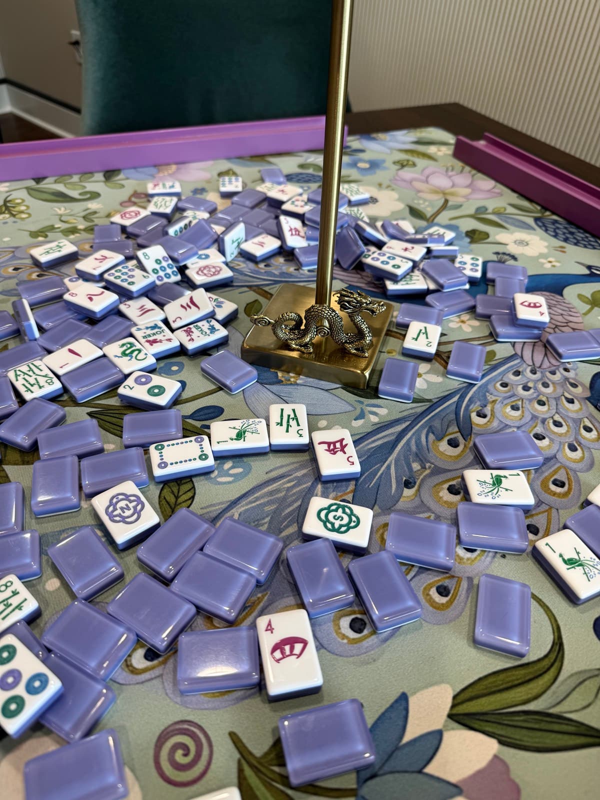 Players enjoying American mahjong at a styled table in East Alabama.