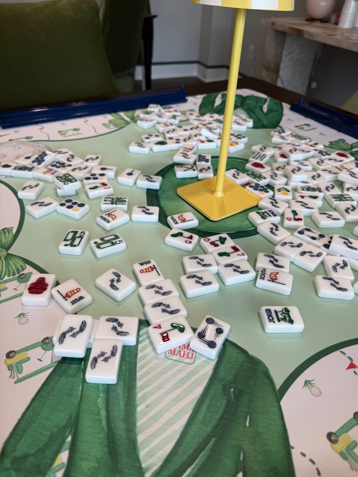 Players enjoying American mahjong at a styled table in Franklin.